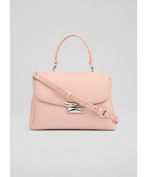The Darcie shoulder bag promises to be your new favourite daytime companion. Fashioned from luxurious pink leather, this top-handle crossbody showcases new branding and a 100% cotton lining, embodying sophistication with every detail. Perfect for a brunch date or adding flair to your everyday jeans and blouse ensemble.