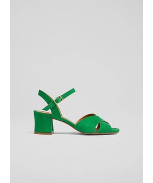 Embrace the essence of an Italian summer with the Alba cross front sandals. Crafted from brown kid suede and  leather, these sandals feature a block heel and a round toe design. Perfect for enhancing your smart casual look, whether you're heading to a weekend brunch or a garden party. Pair them with tailored trousers or a flowing midi skirt for an elegant ensemble.