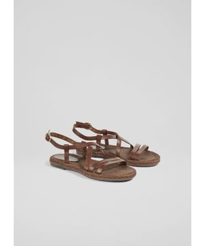 Handcrafted in Spain, the Indie sandals feature luxurious chocolate leather and a multi-strap design. With a comfortable espadrille footbed, they add elegance to any summer wardrobe. Ideal for seaside brunches or garden parties, pair them with a maxi dress or denim shorts for a relaxed, sophisticated style.