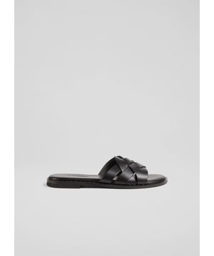 A first for us this season, our new Amara sandals are expertly-made in Greece, and have the unmistakable style of a classic Greek leather sandal. Crafted from beautiful black calf leather, they are an open toe style with a wide criss-cross strap over the foot, an open back and a flat sole. Slide them on and go with summer suiting, wide-leg trousers or your favourite cotton sun dresses.