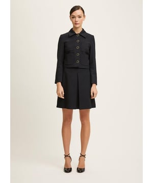 The Halina Black jacket has a chix, boxy fit with gold button details and collar. Wear it with the matching skirt for a matchy suited look, or with jeans and heels for less formal moments.