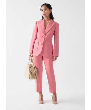 Crafted with Portuguese fabric, the Aimee trousers in a desert rose shade offer a structured silhouette that's both smart and casually elegant. This cigarette leg trouser features a tapered shape and handy side pockets, making it a versatile staple for any wardrobe. Perfect for brunches or casual office outings, pair the Aimee with a white blouse and loafers for a sleek, polished look.