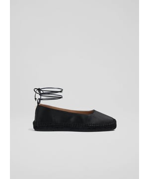 Handmade in Spain, the Mia espadrilles are a blend of tradition and modernity. Featuring an ankle tie, square toe, and black hue, they are a versatile addition to any wardrobe. Ideal for garden parties or casual outings, they pair effortlessly with flowing summer dresses or tailored trousers for a refined look.