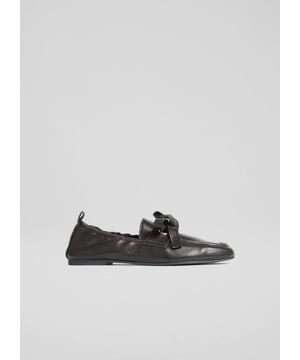 The Maude eyelet bow loafer combines timeless elegance with modern flair. Crafted in Spain from nappa leather in a neutral shade, these loafers feature an eyelet bow on a round-toe design. Suitable for casual outings, they pair with tailored trousers or midi skirts, adding sophistication to any ensemble.