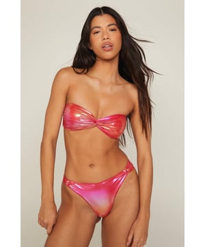 Striking metallic ombre design
        Twist-front bandeau top for added style
        High-cut bikini bottoms with side ties
        Two-piece set for mix-and-match versatility
        Flattering fit to accentuate your curves
    
    Make a splash this summer with NastyGal's Metallic Ombre Twist Bandeau Bikini Set. This eye-catching two-piece swimwear set is perfect for those sun-soaked days by the pool or beach. The twist-front bandeau top offers a trendy look while providing support, and the high-cut bottoms with adjustable side ties allow for a customised fit. Style this shimmering set with oversized sunglasses and a wide-brimmed hat for ultimate poolside glamour. For a chic beach-to-bar transition, throw on a sheer kaftan and strappy sandals. Whether you're lounging on the sand or sipping cocktails at a beachfront bar, this metallic ombre bikini set will ensure you stand out from the crowd.