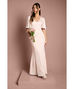 Elegant V-neckline for a flattering silhouette
        Graceful angel sleeves add a touch of romance
        Striking open back design with tie detail
        Floor-length skirt for a sophisticated look
        Luxurious satin fabric for a polished finish
    
    This stunning bridesmaids dress from Coast is the epitome of elegance and grace. Perfect for your role in the bridal party, this gown combines classic sophistication with modern details. The V-neckline and angel sleeves create a romantic silhouette, while the open back with tie detail adds a contemporary twist. The floor-length skirt ensures a refined look as you walk down the aisle. Crafted from sumptuous satin, this dress drapes beautifully and catches the light in all the right ways. Pair with delicate jewellery and strappy heels to complete your bridesmaid ensemble. Whether you're standing beside the bride or dancing the night away at the reception, this dress will ensure you look and feel fabulous throughout the wedding celebrations.