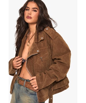 Oversized biker jacket in faux suede for a bold, edgy look
        Asymmetrical zip front closure for a modern twist
        Notched lapels and epaulettes for classic biker style
        Belted hem for adjustable fit and added flair
        Multiple pockets for both style and functionality
    
    Make a statement with this oversized biker jacket that combines timeless style with contemporary flair. The faux suede fabric offers a luxurious look and feel, perfect for those seeking a cruelty-free alternative. Its relaxed fit allows for easy layering, making it ideal for transitional weather. Style it with a simple white tee and denim shorts for a casual daytime look, or throw it over a floral dress for an edgy contrast at informal gatherings. For cooler evenings, pair with skinny jeans and ankle boots to create a sleek silhouette. The versatile nature of this jacket makes it a go-to piece for various casual occasions, from coffee dates to family barbecues. Its ability to effortlessly elevate any outfit ensures you'll stand out whilst remaining comfortably on-trend.