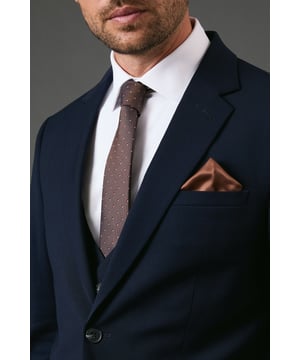 Versatile two-piece set featuring a classic foulard pattern and complementary plain pocket square
        Sophisticated chocolate tone that pairs effortlessly with navy, grey, or black suits
        Pocket square designed for multiple folding styles - from classic peaks to puff folds
        Machine washable at 30 degrees for convenient care and maintenance
        One size design suitable for all formal and smart-casual occasions
    
    Add a touch of refined detail to your suit with this chocolate foulard and plain pocket square set from Burton. The patterned tie displays subtle detailing that brings character to your outfit without overwhelming it, whilst the matching pocket square offers versatility in how you choose to style it. Perfect for the gentleman who appreciates classic styling, this set works brilliantly for everything from office meetings to family celebrations. Pair with a crisp white shirt and navy suit as shown for a timeless look that transitions seamlessly from daytime events to evening gatherings. For more casual occasions, try with an open-collar shirt and blazer combination when heading to weekend lunch or watching the match with friends. This practical yet stylish accessory set allows you to customise your look with minimal effort.