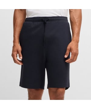 Heren HUGO Stretch-katoen Regular-Fit Shorts met sandwichlogo in donkerblauwCasual shorts in een normale pasvorm van BOSS Menswear. De short heeft een sandwich-logo en is gemaakt van stretchkatoen voor draagcomfort.- Regular fit- Trekkoord- Zakken onderaan voor: Zijzakken- 95% Katoen 5% Elastaan.  Machinewas Koud Zacht- Ref: 50506120-402