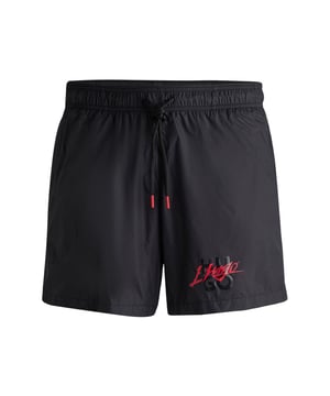 Mens HUGO Paol Fully Lined Swim Shorts with stacked logo in blackSleek quick-drying swim shorts by HUGO Menswear. Featuring full lining and a drawcord waist  this pair is printed with a stacked HUGO logo. This product is created with recycled polyamide made from pre- and post-consumer textile waste or industrial fishing nets. The aim of using recycled materials is to save valuable resources.- Printed logo placed on the left leg centre- Elastic waistband - Side pockets- Back welt pocket. - Length 38cm (Size M)- Main material: 100% Polyamide.  Lining: 100% Polyester.  Inner lining: 100% Polyester.  Machine washable.- Ref: 50510190-006
