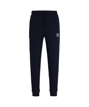 Mens HUGO Doak V Cotton-Terry Tracksuit Bottoms with metallic-effect logo in dark blueCuffed tracksuit bottoms cut to a straight fit in soft terry with a metallic-effect flock-print logo by HUGO Menswear.- Regular fit.- Elastic waist with drawstring.- Side pockets.- Ribbed hems.- Metallic-effect HUGO logo patch on leg.- 100% Cotton.  Machine washable.- Ref: 50501021-405