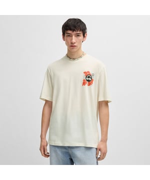 Mens HUGO Nufloro Cotton Jersey T-Shirt with logo prints in open white.The creative logo artwork of this HUGO Menswear T-shirt will add signature impact to your casual looks.- Comfortable jersey.- Easy regular fit. - Crew neck- Short sleeves- Standard length- 100% Cotton.  Machine washable.- Ref: 50533387-121