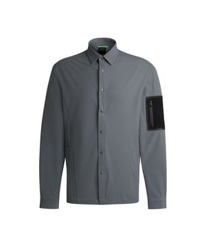 Heren BOSS Expedit Relaxed Fit Waterafstotend Overshirt in donkerbeigeEen waterafstotend overshirt van stretchmateriaal van BOSS. Dit relaxed-fit overshirt heeft een naadloze merkzak op de mouw.- Relaxed fit- Kent kraag- Drukknoopsluiting- Stretchy waterafstotende stof- Zak met rits op de linkermouw- Rechte manchetten- 55% Polyamide (gerecycled) 35% Polyamide 10% Stretch synthetische vezel.  Machinewasbaar.- Ref: 50523354-251