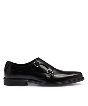 Mens HUGO Kerr Monk Shoes in black- Smooth leather upper- Buckle closure- Pointed last- Branding detail on the upper side and on the tongue. - Stitching detail to enrich the design.- Upper: 100% Cow leather.- Ref: 50517214-001