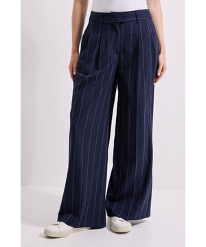 Wide leg silhouette with elegant pleated front detail for added dimension
        Distinctive pinstripe pattern throughout for a sophisticated touch
        Flattering high-rise waistband with stylish belt detail
        Practical side pockets for everyday convenience
        Flowing, full-length design that creates a graceful drape
    
    These Belt Detail Pinstripe Pleated Wide Leg Trousers from Dorothy Perkins offer the perfect blend of comfort and style for your daywear wardrobe. The classic pinstripe pattern brings a refined touch to casual settings, while the wide leg silhouette creates a relaxed yet put-together look. Style them with a simple white t-shirt and trainers for weekend brunches with friends, or pair with a lightweight jumper and ballet flats for family gatherings. The high-rise waistband with belt detail accentuates your waist beautifully, while the pleated front adds a tailored element to this otherwise casual piece. These versatile trousers can be easily dressed up with a matching blazer for a coordinated outfit that's perfect for baby showers or informal work events. The woven fabric ensures these trousers maintain their shape throughout the day while providing all-day comfort.