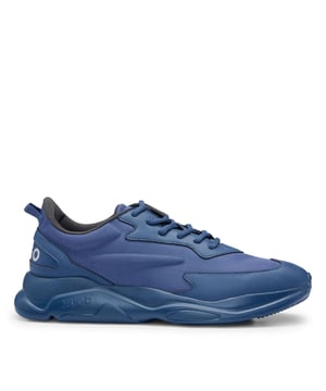 Mens HUGO Leon Running-Inspired Trainers with contrast details in navySignature trainers by HUGO  set on an EVA outsole and crafted in a mix of materials with contrast detailing and branding throughout.- Laces- Partially lined- Packaging: Box- Upper material: 100% Polyester.  Lining: 100% Polyester.  Sole: 100% Ethylene vinyl acetate.  Facing: 60% Polyester  40% Polyurethane.  Innersole: 100% Polyester.- Ref: 50517096-413