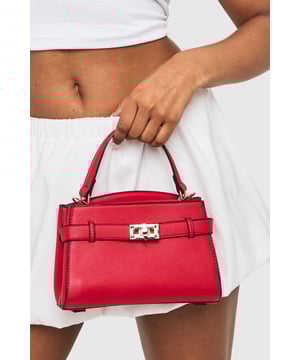 Structured mini bag with elegant buckle strap detail across the front
        Sophisticated gold-tone hardware adds a touch of glamour
        Practical top handle for easy carrying
        Compact yet spacious interior with organised compartments
        Versatile design perfect for day-to-night transitions
    
    This chic Buckle Strap Detail Mini Bag from Boohoo is the ultimate accessory for your night out ensemble. The structured silhouette creates a polished look while the distinctive buckle detail adds character to this compact piece. Despite its mini size, the bag offers surprising functionality with interior compartments to keep your essentials organised. Style with a crisp white crop top and high-waisted shorts for casual drinks, or pair with your favourite bodycon dress and strappy heels when hitting the club. The top handle design allows for effortless carrying while dancing the night away. This versatile piece works brilliantly for everything from casual meet-ups with friends to more glamorous evening occasions, ensuring you'll always have the perfect finishing touch for your going-out wardrobe.