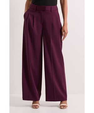 Elegant wide leg silhouette with flowing pleated design for graceful movement
        Sophisticated belt detail adds structure and definition to the waistline
        Practical side pockets discreetly integrated into the design
        Classic high-rise waistband for a flattering and comfortable fit
        Versatile woven fabric that maintains shape throughout the day
    
    These Dorothy Perkins Belt Detail Pleated Wide Leg Trousers combine contemporary styling with everyday comfort. The generous wide leg cut creates a dramatic silhouette whilst the pleated detailing adds texture and sophistication. Perfect for daytime occasions, style these trousers with a fitted turtleneck and ballet flats for a casual brunch with friends. For family gatherings, pair with a tucked-in blouse and minimal jewellery for an effortlessly chic ensemble. The belt detail accentuates your waist beautifully, creating a balanced proportion with the flowing wide legs. These trousers transition seamlessly from weekend coffee dates to casual office settings when paired with a tailored blazer, as shown in the styling. Their versatility makes them an essential addition to your wardrobe, offering both comfort and style for your everyday social occasions.