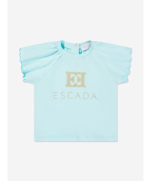 Introducing the Escada Baby Girls Embroidered Logo T-Shirt in Blue, an exquisite addition to your little princess's wardrobe for SS2025. Revel in the charm and class of this essential piece Exquisite Embroidery Features the iconic Escada logo delicately embroidered, adding a touch of luxury. Premium Fabric Crafted from the finest materials, ensuring comfort durability for all-day wear. Versatile Shade A beautiful blue hue that complements any outfit, making it a versatile staple. Perfect for Special Occasions Ideal for garden parties or family gatherings.Elevate her style with Escada's sophistication.