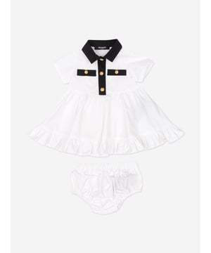 Introducing the exquisitely designed Baby Girls Polo Dress with Knickers in White by Balmain. Crafted in Italy, this essential piece epitomizes luxury and sophistication for SS2025. Features include Impeccable Italian Craftsmanship Precision-made for durability and timeless style. Pristine White Hue A classic, crisp white that complements any occasion. Luxurious Comfort Constructed from premium fabrics to ensure your little one enjoys supreme comfort. Coordinated Ensemble Comes with matching knickers for a complete, stylish look.Elevate her wardrobe with this quintessential Balmain set!