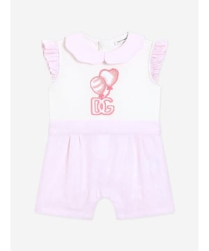 Introduce a touch of Italian elegance to your little one's wardrobe with the Dolce Gabbana Baby Girls Embroidered Romper in Pink. Perfect for the stylish tots of SS2025, this exquisite piece is a blend of luxury and charm. Exquisitely Crafted in Italy Delicately made to ensure unparalleled quality and enduring wear. Captivating Embroidery Features intricate embroidery, adding a dash of sophistication. Luxurious Comfort Crafted from premium fabrics for the softest touch against delicate skin. Perfect for Special Occasions Ideal for celebrations, adding a sparkle to memorable moments.Adorn your darling in Dolce Gabbana's finestwhere fashion meets affection.