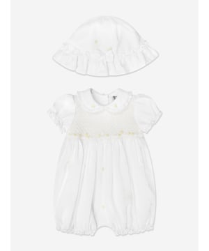 Sarah Louise embody a pristine bygone era in their traditional designs. This baby girls bubble hat romper set is reflective of the brand's intricate handmade needlework. Engineered in a white and lemon design with a smocked stitching on the bodice. It has a Peter Pan collar with ruffled detail, short puffy elasticated sleevestrims, and is adorned with floral butterfly embroideries. 65 Polyester, 35 Cotton