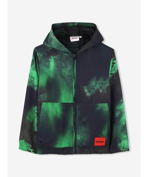 Elevate your young gentleman's fashion repertoire with the Hugo Boys Hooded Windbreaker in Green for SS2025. Meticulously crafted to blend sophistication with practicality, this windbreaker is an essential addition to his wardrobe. Striking Green Hue A vibrant, eye-catching green that ensures your boy stands out stylishly. Superior Craftsmanship Constructed from premium materials for durability and comfort. Functional Design Equipped with a protective hood and secure pockets for functionality. Revolutionise his seasonal outings with this exquisite Hugo creation.