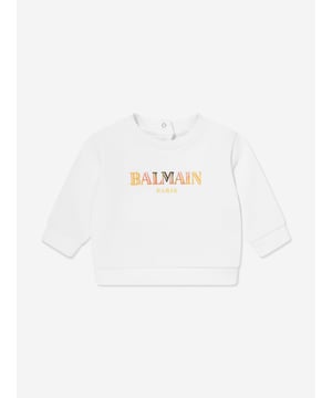 Introducing the exquisite Baby Logo Sweatshirt in White by Balmain, a staple for the SS2025 season. Crafted meticulously to blend high fashion with everyday comfort for your little one. Key features include Iconic Balmain logo Elevates wardrobe with a luxurious touch. Supreme comfort Crafted from premium fabric for softness. Timeless style Classic white hue ensures versatile wear.Revamp your child's collection with flawless elegance. Perfect for any occasion! Order now.