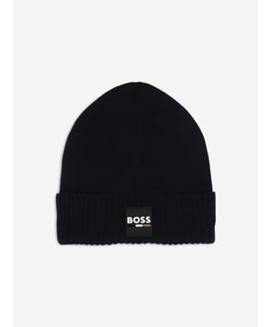 Introducing the Boys Logo Badge Beanie Hat in Navy by BOSS, the perfect addition for stylish warmth in AW2024. Sophisticated yet playful, this designer beanie is a stellar pick for any young trendsetter's wardrobe. Here are the standout features Iconic BOSS Logo Features a prominent, chic badge enhancing its designer appeal. Premium Fabrication Crafted from luxurious, soft materials to keep warm while ensuring comfort. Deep Navy Blue A versatile and classic colour that matches effortlessly with various outfits. Durable Design Built to last, ideal for seasonal adventures and day-to-day wear.Refresh your boy's look this season with this stylish beanie from BOSS. Order now to add a touch of designer flair to his cold-weather ensemble!