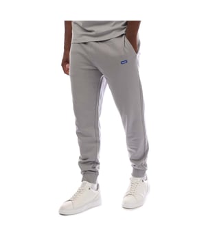 Mens HUGO Napin Cotton-Terry Tracksuit Bottoms with blue logo patch in open greyThese cuffed tracksuit bottoms by HUGO Menswear are guaranteed to offer downtime comfort. Designed in soft French terry cotton.- Elasticated waistband.- Blue logo patch.- Regular fit- Cuffed leg- 100% Cotton.  Machine washable.- Ref: 50522372-084