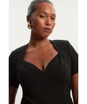 This Karen Millen bodysuit combines timeless style with modern practicality. The sweetheart neckline frames your dcolletage, while the short sleeves provide just the right amount of coverage for daytime events. The regular fit ensures comfort without sacrificing style, and the stretchy jersey fabric moves with you throughout the day. Style with high-waisted wide-leg trousers for a polished daytime look perfect for family gatherings or weekend brunches. The versatile design transitions effortlessly from day to evening, making it an essential addition to your capsule wardrobe that works across seasons.  Flattering sweetheart neckline Short sleeves Smooth jersey fabric Gold-tone back zip closure Bodysuit design
