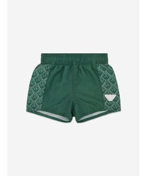 Introducing the exquisite Baby Boys Logo Swim Shorts in Green by Emporio Armani, a splendid addition to any little chap's wardrobe for SS2025. Heres why this piece is a must-have Iconic EA Branding Features the esteemed Emporio Armani logo, synonymous with luxury style. Vibrant Green Hue A cheerful shade that catches the eye, perfect for sunny days. Supreme Comfort Crafted for delicate skin with soft, top-quality fabric. Durable Practical Designed to withstand the rigors of playful adventures.Elevate his style this season a true investment in fashion and comfort!