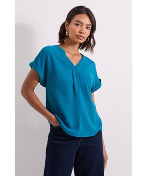 Elegant V-neckline design for a flattering silhouette
        Grown-on sleeves with stylish turn-up cuffs
        Relaxed fit through the body for all-day comfort
        Lightweight woven fabric perfect for layering
        Versatile length that works tucked in or worn loose
    
    This Dorothy Perkins V Neck Grown On Sleeve Top combines effortless style with everyday wearability. The relaxed silhouette and clean lines make it a wardrobe essential that transitions seamlessly from day to evening occasions. Style it as seen with wide-leg denim and flat sandals for a casual brunch with friends, or tuck into a pencil skirt with ballet flats for family gatherings. The grown-on sleeve detail adds a contemporary touch while maintaining a timeless appeal. For cooler days, layer under a cardigan or lightweight jacket without compromising on style. This top strikes the perfect balance between comfort and sophistication-ideal for the woman who wants to look put-together without appearing overdressed. Machine washable for easy care, this versatile piece will quickly become a go-to favourite in your casual rotation.