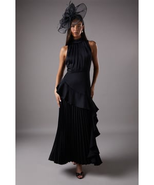 Sleeveless design with high neck for a sophisticated silhouette
        Elegant ruffle detail adds a touch of drama and movement
        Pleated skirt creates a flowing, graceful look
        Satin-back crepe fabric offers a luxurious sheen
        Tie-back detail for an adjustable and secure fit
    
    Make a striking entrance at your next formal event with this captivating sleeveless dress from Coast. The high neck and ruffle detailing convey a sense of refinement, while the pleated skirt adds a touch of whimsy and movement. Perfect for weddings, races, or sophisticated soires, this dress is a versatile addition to your occasion wear wardrobe. Style it with strappy metallic heels and a clutch bag for a polished ensemble. For cooler evenings, drape a lightweight shawl over your shoulders. The satin-back crepe fabric ensures comfort throughout your event, while the tie-back detail allows for a customised fit. This dress is sure to turn heads and keep you feeling confident all day long.