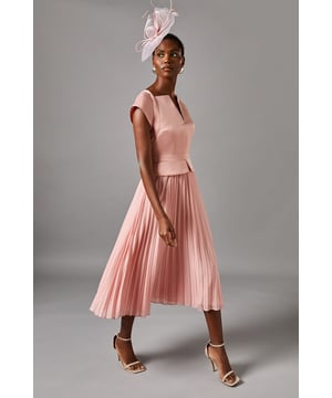 Elegant cap sleeve design for a sophisticated silhouette
        Notch neckline adds a unique and flattering touch
        Pleated skirt creates graceful movement and dimension
        Midi length offers versatility for various occasions
        Waist-defining belt detail enhances the feminine shape
    
    Embrace timeless elegance with this captivating midi dress from Coast. The cap sleeves and notch neckline create a refined upper silhouette, while the pleated skirt adds a touch of whimsy and movement. Perfect for weddings, races, or formal gatherings, this dress embodies sophistication. Style it with strappy metallic heels and a clutch for a polished look. For cooler evenings, drape a lightweight shawl over your shoulders. The versatile midi length allows for easy transition from day to night events. Accessorise with delicate jewellery to complement the dress's graceful lines. Whether you're attending a garden party or a cocktail soire, this dress will ensure you stand out with effortless charm and poise.