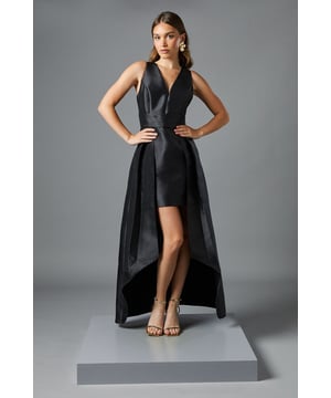 Dramatic plunge neckline creates a striking silhouette
        Innovative two-in-one design featuring a fitted mini dress with elegant maxi overskirt
        Structured twill fabric provides exceptional shape retention
        Sleeveless cut showcases shoulders beautifully
        Sophisticated high-low hemline adds movement and drama
    
    Make a captivating entrance in this architectural Coast maxi dress. The clever design combines a figure-hugging mini dress with a sweeping overskirt, offering two distinct looks in one. The deep plunge neckline frames your dcolletage whilst the structured twill fabric ensures the silhouette maintains its impressive form throughout your event. Perfect for weddings and formal occasions, style with statement earrings as shown for maximum impact. For race day sophistication, add a sculptural fascinator and clutch bag. The dramatic high-low hemline allows you to showcase elegant heeled sandals whilst providing the grandeur of a full-length gown from behind. This versatile piece transitions effortlessly from daytime celebrations to evening receptions, ensuring you remain the epitome of refined glamour.