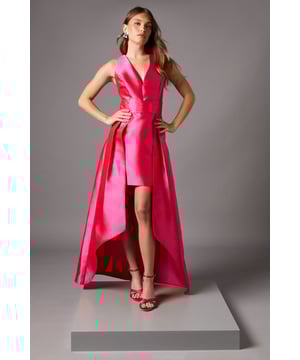 Dramatic plunge neckline creates a striking silhouette
        Innovative two-in-one design featuring a fitted mini dress with elegant maxi overskirt
        Structured twill fabric provides exceptional shape retention
        Sleeveless cut showcases shoulders beautifully
        Sophisticated high-low hemline adds movement and drama
    
    Make a captivating entrance in this architectural Coast maxi dress. The clever design combines a figure-hugging mini dress with a sweeping overskirt, offering two distinct looks in one. The deep plunge neckline frames your dcolletage whilst the structured twill fabric ensures the silhouette maintains its impressive form throughout your event. Perfect for weddings and formal occasions, style with statement earrings as shown for maximum impact. For race day sophistication, add a sculptural fascinator and clutch bag. The dramatic high-low hemline allows you to showcase elegant heeled sandals whilst providing the grandeur of a full-length gown from behind. This versatile piece transitions effortlessly from daytime celebrations to evening receptions, ensuring you remain the epitome of refined glamour.
