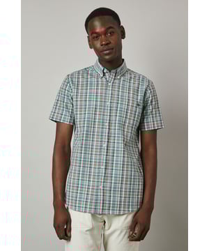 Classic button-down collar for a refined casual look
        Short sleeves with neat hems perfect for warmer weather
        Traditional check pattern adds visual interest and versatility
        Chest pocket with subtle Maine brand detailing
        Regular fit with back pleat for enhanced comfort and movement
    
    This Maine short sleeve shirt showcases a timeless check pattern that brings a touch of sophistication to your summer wardrobe. The button-down collar maintains structure while keeping things casual, making it ideal for various daytime occasions. As seen on our model, pair this versatile shirt with light-coloured shorts and white trainers for an effortlessly stylish weekend look. The shirt works brilliantly for family barbecues, casual garden parties, or relaxed pub lunches with friends. For a smarter appearance, tuck it into chino trousers and add a canvas belt. The breathable fabric ensures comfort during warmer days, while the classic pattern ensures this piece will remain a staple in your collection for seasons to come. Perfect for packing on weekend getaways or summer holidays when you need an easy-to-style option that delivers on both comfort and style.