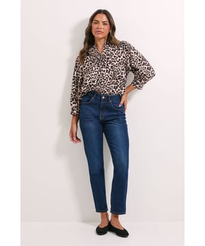Stylish overhead design with easy pull-on styling
        Flattering V-neckline that frames the face beautifully
        Relaxed fit through the body for comfortable all-day wear
        Elegant balloon sleeves with neat cuffed finish
        Versatile woven fabric that drapes gracefully
    
    Make a statement with this eye-catching leopard printed overhead shirt from Dorothy Perkins. The relaxed silhouette offers effortless style whilst maintaining a put-together look that's perfect for various occasions. Pair with straight-leg jeans and ballet flats for casual weekend brunches, or dress up with tailored trousers and ankle boots for informal gatherings. The V-neckline adds a feminine touch without revealing too much, whilst the balloon sleeves create visual interest and contemporary flair. This versatile piece transitions seamlessly from family gatherings to coffee dates with friends. For a polished daytime ensemble, tuck the front into high-waisted denim and add simple gold-toned jewellery to complete the look. Machine washable for easy care, this shirt will quickly become a go-to favourite in your wardrobe rotation.