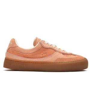 The GOOD NEWS Lagoon elevates everyday casual with its striking pink suede crafted from premium deadstock materials. These handmade court trainers balance eco-conscious design with street-ready style, featuring subtle stamped GN motifs and sturdy rubber soles for dependable grip. The chunky organic cotton laces add textural interest, while recycled mesh lining ensures breathable comfort. Perfect for the conscious consumer who refuses to sacrifice style for sustainability in their footwear selection.