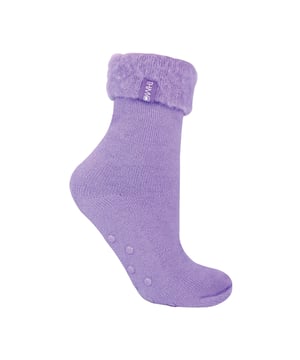 THMO Ladies Thermal Turnover Bed Socks: Embrace the cosy comfort of our THMO Bed Socks, your perfect pair for those chilly winter days and nights. As the temperature drops, it's essential to keep yourself warm while also saving on heating bills. Treat yourself to the ultimate warmth without compromising your budget. Crafted using a specially selected heavy bulk acrylic yarn, these socks possess exceptional thermal qualities that will keep your feet cosy even in the coldest of winters. To enhance their insulating properties, the socks have been double brushed on the inside, creating a plush and velvety texture that maximises warmth and provides softness against your skin. By effectively trapping warm air and enveloping your feet in comfort, these bed socks are the perfect choice for those moments of indoor relaxation and tranquillity. . An innovative anti-slip grip has been designed onto the foot of the sock in order to prevent you from slipping on surfaces such as hard wooden floors or kitchen tiles. . These THMO thermal bed socks are available in 3 colours: Purple, Pink & Blue, with dotted grippers. They are available in one size Ladies 4-8 UK. They are made from 93% Acrylic, 6% Polyamide & 1% Elastane. They are also safely machine washable. Extra Product Details: THMO Slipper Bed Socks Double Brushed Inner Thick & Warm Hand Linked Toe Turnover Top 3 Colour Options