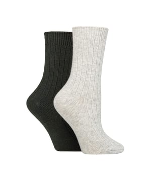 Wildfeet - Ladies 2 Pack Cashmere Bed Socks: In a soft, cosy blend including luxury cashmere, natural wool and viscose, these ladies’ Wildfeet Cashmere Socks are the ideal accompaniment to your day, whether you’re out walking around in the cold or snuggled up at home on the sofa. The mix of wool & viscose (from bamboo) fibres are used to make these socks more practical and durable than cashmere alone, but maintain its breathability, insulating and moisture-managing abilities. They also have a ribbed leg for added comfort, and come as a twin pack, have a medium gauge thickness and are in a crew length, making them a great choice for all your leisure shoes and boots, bringing a little extra luxury and comfort to your every outfit. These two pairs of Wildfeet Cashmere Socks come attractively wrapped with a satin ribbon bow, which makes them ideal for gifting to friends or family. . Wild Feet is a range of socks featuring cool designs, bold colours and quirky catchphrases - from pugs and penguins, to lions and llamas! . There are 14 colours to choose from. They come in one size Ladies 4-8 UK, are made from 37% Wool, 27% Viscose, 24% Polyamide, 11% Cashmere, 1% Elastane and are machine washable. Extra Product Details: Ladies Wildfeet Bed Socks Wool & Cashmere Blend Fibres 14 Great Colour Options Made For Relaxing Ribbed Legs 2 Pairs Per Pack A Great Gift Idea The Ideal Stocking Filler