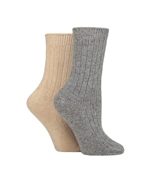 Wildfeet - Ladies 2 Pack Cashmere Bed Socks: In a soft, cosy blend including luxury cashmere, natural wool and viscose, these ladies’ Wildfeet Cashmere Socks are the ideal accompaniment to your day, whether you’re out walking around in the cold or snuggled up at home on the sofa. The mix of wool & viscose (from bamboo) fibres are used to make these socks more practical and durable than cashmere alone, but maintain its breathability, insulating and moisture-managing abilities. They also have a ribbed leg for added comfort, and come as a twin pack, have a medium gauge thickness and are in a crew length, making them a great choice for all your leisure shoes and boots, bringing a little extra luxury and comfort to your every outfit. These two pairs of Wildfeet Cashmere Socks come attractively wrapped with a satin ribbon bow, which makes them ideal for gifting to friends or family. . Wild Feet is a range of socks featuring cool designs, bold colours and quirky catchphrases - from pugs and penguins, to lions and llamas! . There are 14 colours to choose from. They come in one size Ladies 4-8 UK, are made from 37% Wool, 27% Viscose, 24% Polyamide, 11% Cashmere, 1% Elastane and are machine washable. Extra Product Details: Ladies Wildfeet Bed Socks Wool & Cashmere Blend Fibres 14 Great Colour Options Made For Relaxing Ribbed Legs 2 Pairs Per Pack A Great Gift Idea The Ideal Stocking Filler