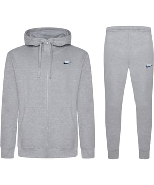 Layer up in this men's Foundation Tracksuit from Nike. In a Dark Grey Heather colourway, this matching set includes a full zip hoodie and standard fit joggers, both made from soft brushed fleece for all-day comfort. The hoodie features an adjustable drawstring hood, full-zip fastening, ribbed trims, and a split kangaroo pocket for essential storage. The joggers come with an elastic waistband and adjustable drawcord for a custom fit, ribbed ankle cuffs to maintain shape, and side pockets for convenience. Finished with signature Nike Swoosh embroidery to the chest and thigh for a classic look.