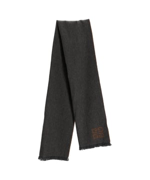 VINTAGE, RRP AS NEW
Wrap yourself in luxury with the Givenchy Monogram Fringed Reversible Scarf, crafted in soft wool and showcasing the iconic logo in versatile grey and brown tones. The reversible design offers two chic looks in one, finished with delicate fringe detailing for a touch of texture. **Styling tip:** Drape it over a tailored coat or belt it at the waist over a neutral sweater dress for effortless cold-weather sophistication.

Givenchy Monogram Fringed Reversible Scarf in Grey and Brown Wool

Condition: Excellent
Signs of wear:  No sign of wear.
Packaging: None
Color: Grey
Material: Wool
Size: One Size | One Size
Measurements: Height: 1840; Length: 450
SKU: TONPUDEAC507957W