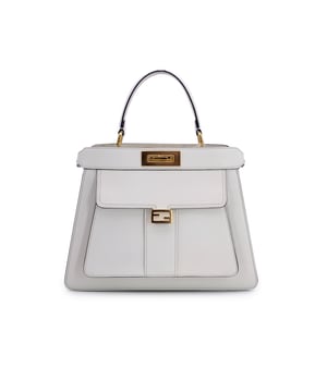 VINTAGE, RRP AS NEW
This beautiful Bag will come with a Certificate of ity provided by Entrupy. The certificate will be provided at no further cost.  A modern icon with roots in timeless Italian craftsmanship, this Fendi Selleria Peekaboo ISeeU bag in crisp white leather is elegance made effortless. Designed with a structured silhouette and exquisite attention to detail, it features two compartments separated by a rigid partition-each secured by the signature turn-lock closure.  Inside, a soft leather lining offers refined contrast, with a side open pocket for smaller essentials. The exterior includes a front pocket with magnetic button, perfect for quick access. The light gold-tone hardware, top carry handle, and an adjustable, removable shoulder strap add versatility, while five protective metal feet ensure it stands gracefully wherever it rests.  Finished with 'Fendi' embossed on the interior and crafted with the brand's celebrated Selleria stitching, this bag is both an everyday companion and a statement piece. Originally retailing for €4,500, it's a sophisticated investment in craftsmanship and style. Condition Rating: A - EXCELLENTCondition Details: Gently used. Please check the photos carefully and ask if you need to know more details or if you have any doubts.Measurements (cm):Depth: 11.4Height: 25.4Length: 33.0Other Details: Dustbag? YesKeys? NoBox? No Measurments:  width: 114 mm length: 330 mm height: 254 mm