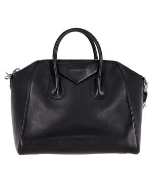 VINTAGE, RRP AS NEW
Introducing the Givenchy Medium Antigona Satchel in Black Leather, a timeless and iconic piece that boasts the signature envelope fold logo and structured shape adored by Givenchy enthusiasts. This classic satchel is adorned with elegant silvertone hardware and metal logo detailing, exuding refined sophistication. Completing the ensemble are two rigid rolled leather top handles for a polished touch, along with a longer leather shoulder strap featuring silvertone detailing, ultimately offering both versatility and style in one impeccable design.
with Dust bag
Givenchy Medium Antigona Satchel in Black Leather 
Condition: Excellent
Signs of wear: No retail tag, No visible sign of wear., 
Packaging: Dust bag
Color: black
Material: Leather | leather
Size: One Size
Measurements: Width: 180; Height: 280; Length: 350; Handle drop: 90; Strap length: 800
SKU: 399107 / NAPPUGBBA396452W