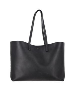 VINTAGE, RRP AS NEW
Effortlessly chic and endlessly practical, this Saint Laurent East/West tote is the definition of understated luxury. Crafted in Italy from supple black textured leather, it features a roomy, unstructured silhouette that fits everything from your laptop to a makeup bag. A gleaming gold 'YSL' charm and detachable coin pouch complete the polished design. The perfect carryall for your workday, weekend, or in-flight essentials.


Saint Laurent East/West Large Textured Tote in Black Leather
Condition: Very good
Signs of wear: No retail tag, Minor sign of wear or markings., Lightly used but very well maintained. Minor creasing, light worn corners, light scratches.
Packaging: None
Color: black
Material: Leather | leather
Size: One Size | One Size
Measurements: Width: 470; Height: 150; Length: 280; Handle drop: 120; Strap length: 300
SKU: NAPPUGBBA516705W