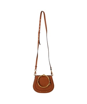 VINTAGE, RRP AS NEW
This stylish and quirky bag from Chole will be your new favourite accessory! The bag comes with an interesting bracelet handle for an easy carrying experience and a removable shoulder strap. Crafted from leather the bag has a suede lined interior that will hold all your daily essentials. From the way it has been crafted to the way it has been designed, this bag makes a loud fashion statement with every detail.


Chloé Small Nile Bracelet Shoulder Bag in Brown Leather
Condition: Excellent
Signs of wear: No retail tag, No visible sign of wear., 
Packaging: None
Color: Brown | ochre
Material: Leather | sheep leather
Size: One Size | One Size
Measurements: Width: 70; Height: 160; Length: 190; Handle drop: 370; Strap length: 1170
SKU: NAPPUDEBA526169W