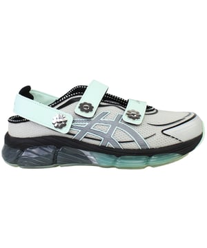 The ASICS × Cecilie Bahnsen Gel‑Quantum 360 VIII trainers blend cutting-edge sports performance with couture-level design. This limited-edition collaboration reimagines ASICS’ iconic full-GEL cushioning in a sandal-style silhouette featuring sculptural velcro straps adorned with delicate floral motifs. Crafted in a sophisticated grey palette, these trainers offer a wearable yet refined aesthetic that bridges athletic functionality with feminine elegance.
Key Features
Division Space Midsole Technology

Incorporates space between the GEL and midsole layers, delivering lightweight cushioning and enhanced responsiveness 

Full-Length GEL® 360 Cushioning

Surrounds the foot in cushioned support, providing superior shock absorption and plush comfort with every step 

FF Blast Plus ECO Foam

Utilizes eco-friendly foam with at least 20% sugarcane-derived biomass for resilience and sustainable performance 

5D Printed Mesh Upper

Tech-inspired, two-tone mesh base enhanced with three-dimensional prints that mimic organic, ergonomic structures 

Sandal-Inspired Velcro Straps

Three adjustable straps—including two Mary Jane style and one heel strap—each accented with metal flower embellishments for both decoration and secure fit 

Semi‑Transparent Rubber Outsole

Reveals a floral print nestled under the sole, blending design artistry with practical traction 

Advanced TRUSSTIC™ &amp; External Heel Counter

Integrated stability solutions provide structure and dynamic support during movement.